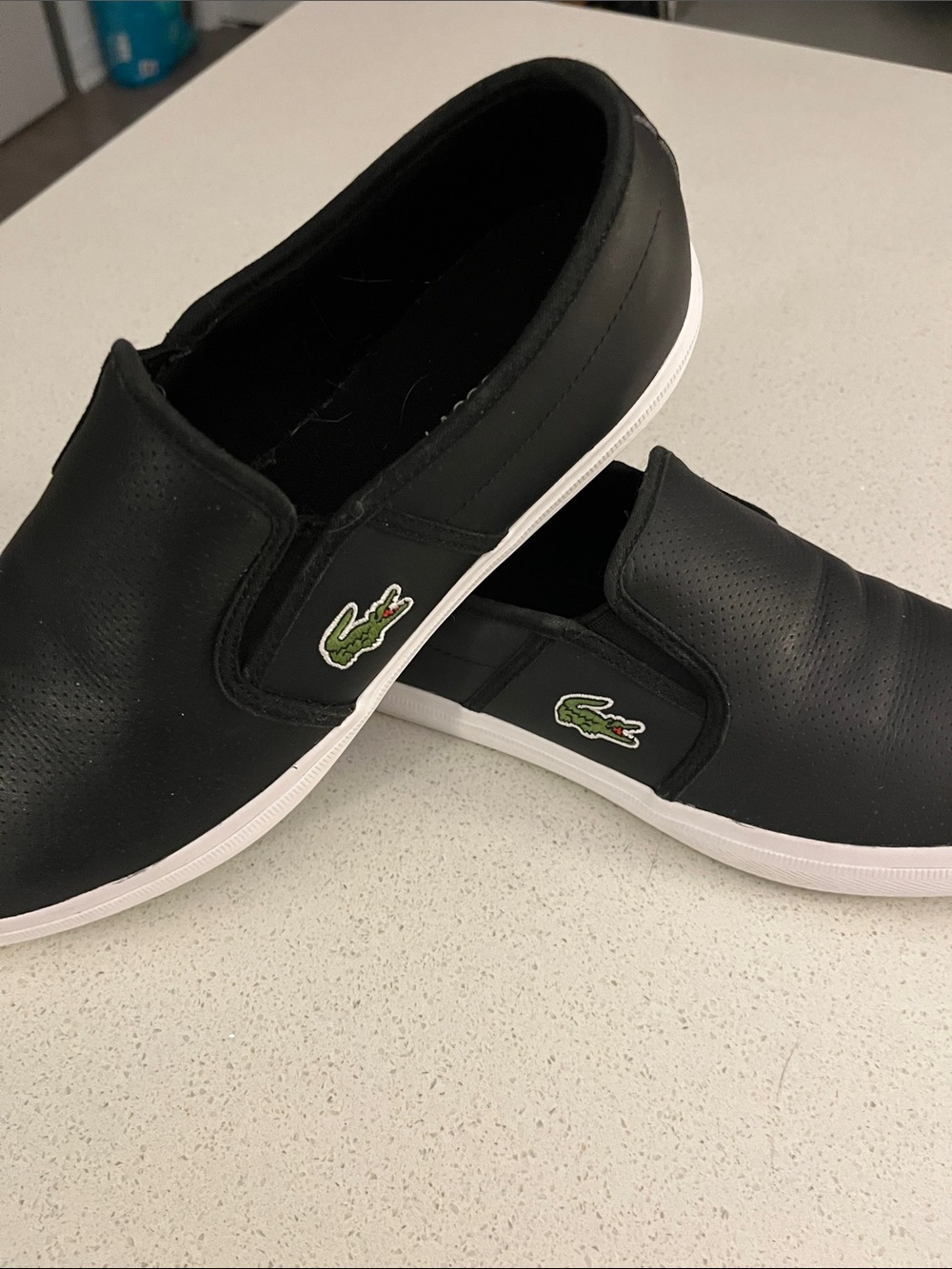 Lacoste Black Perforated Slip-On Loafers with White Soles